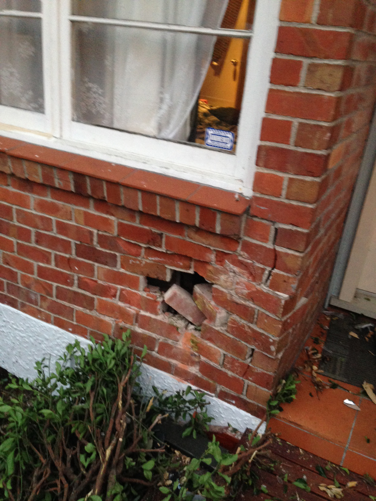 A hole has been created in Derrick Jackson's wall following the impact. Photo / Jesse Bourke-Jackson